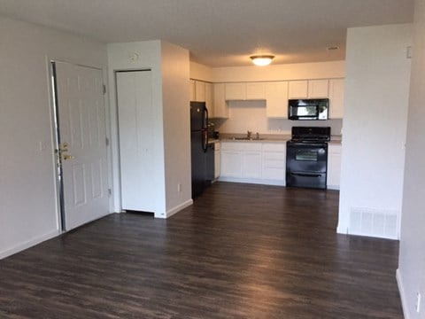 bright white clean cabinets, wood flooring, lots of storage at regency apartments in Bettendorf Iowa